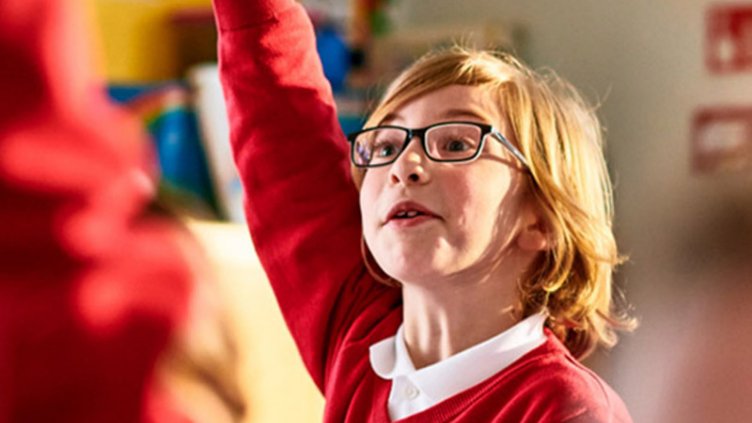 A school girl raising her hand