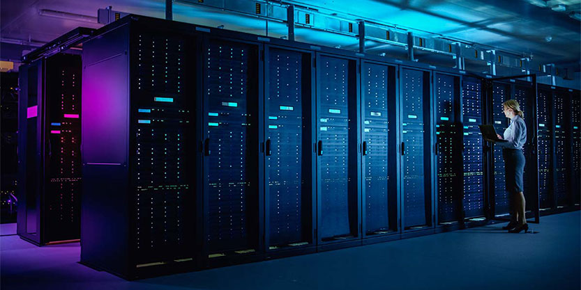 Woman running maintenance on servers
