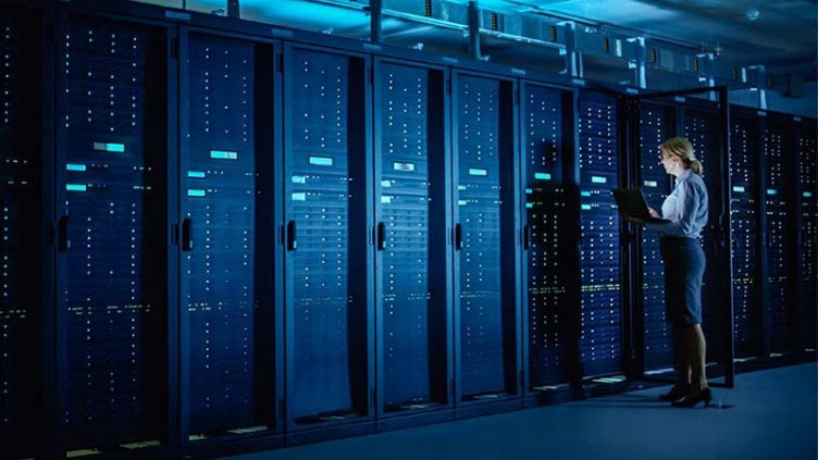 Woman running maintenance on servers
